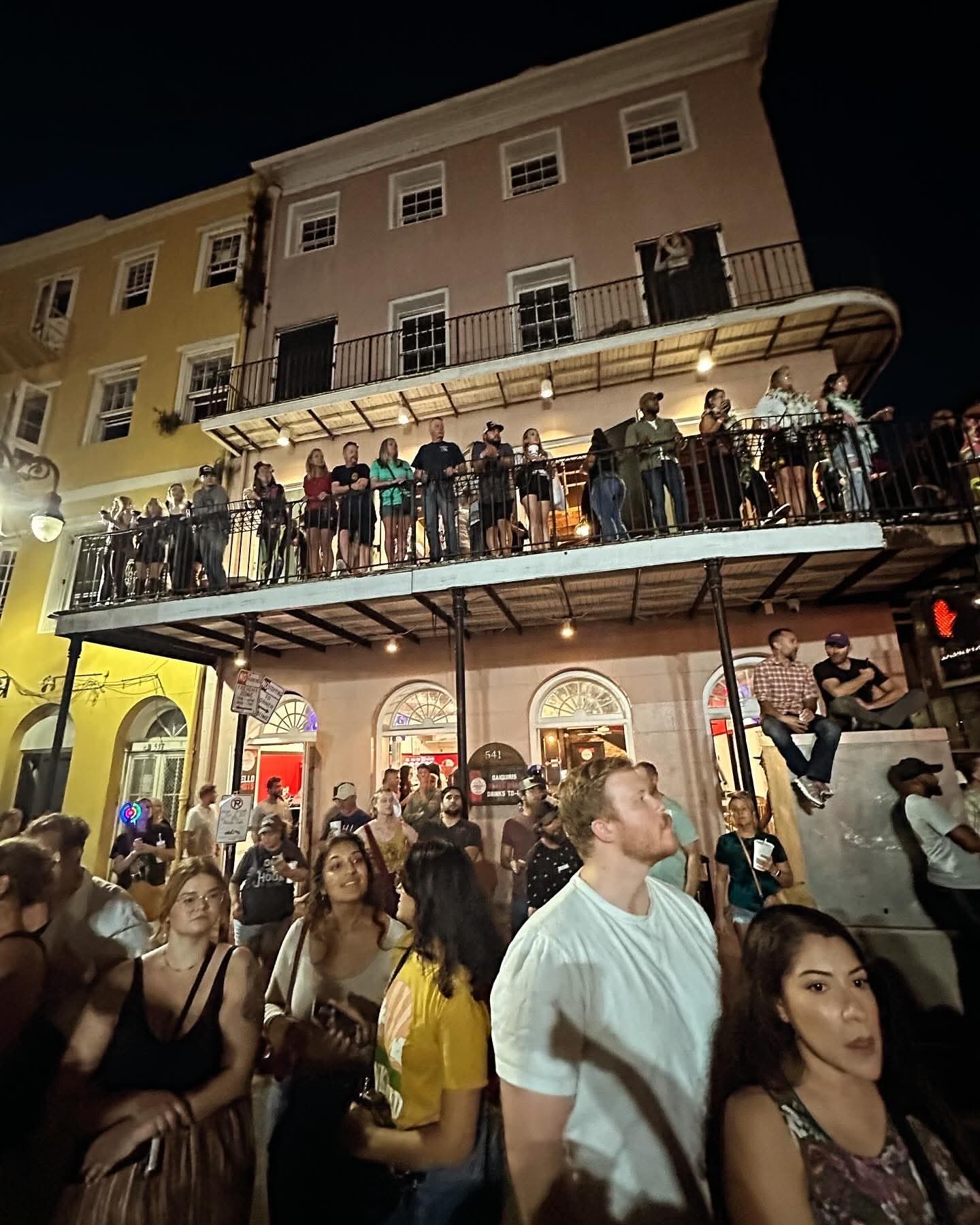 Toulouse Terrace balconies at night above Decatur Street