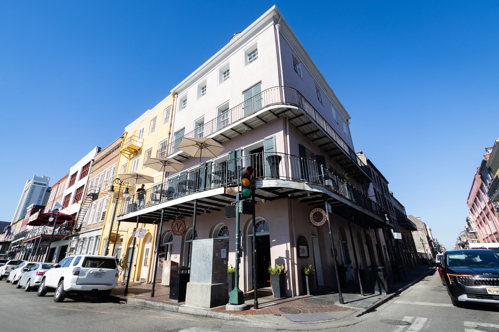 Toulouse Terrace building on Decatur Street with wrap-around wrought-iron balconies