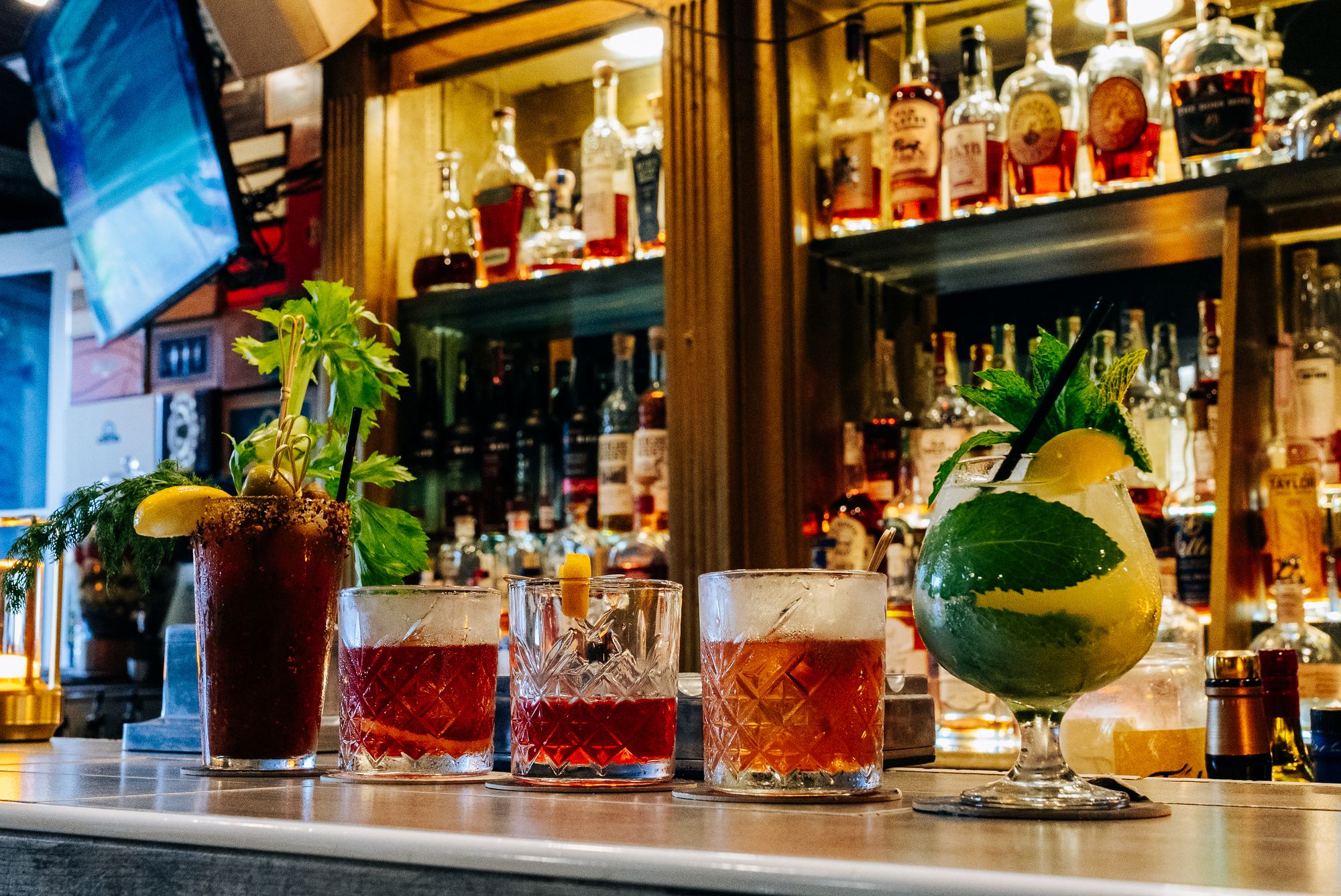 Bloody Mary, Sazerac, Old Fashioned and mojito served on the bar