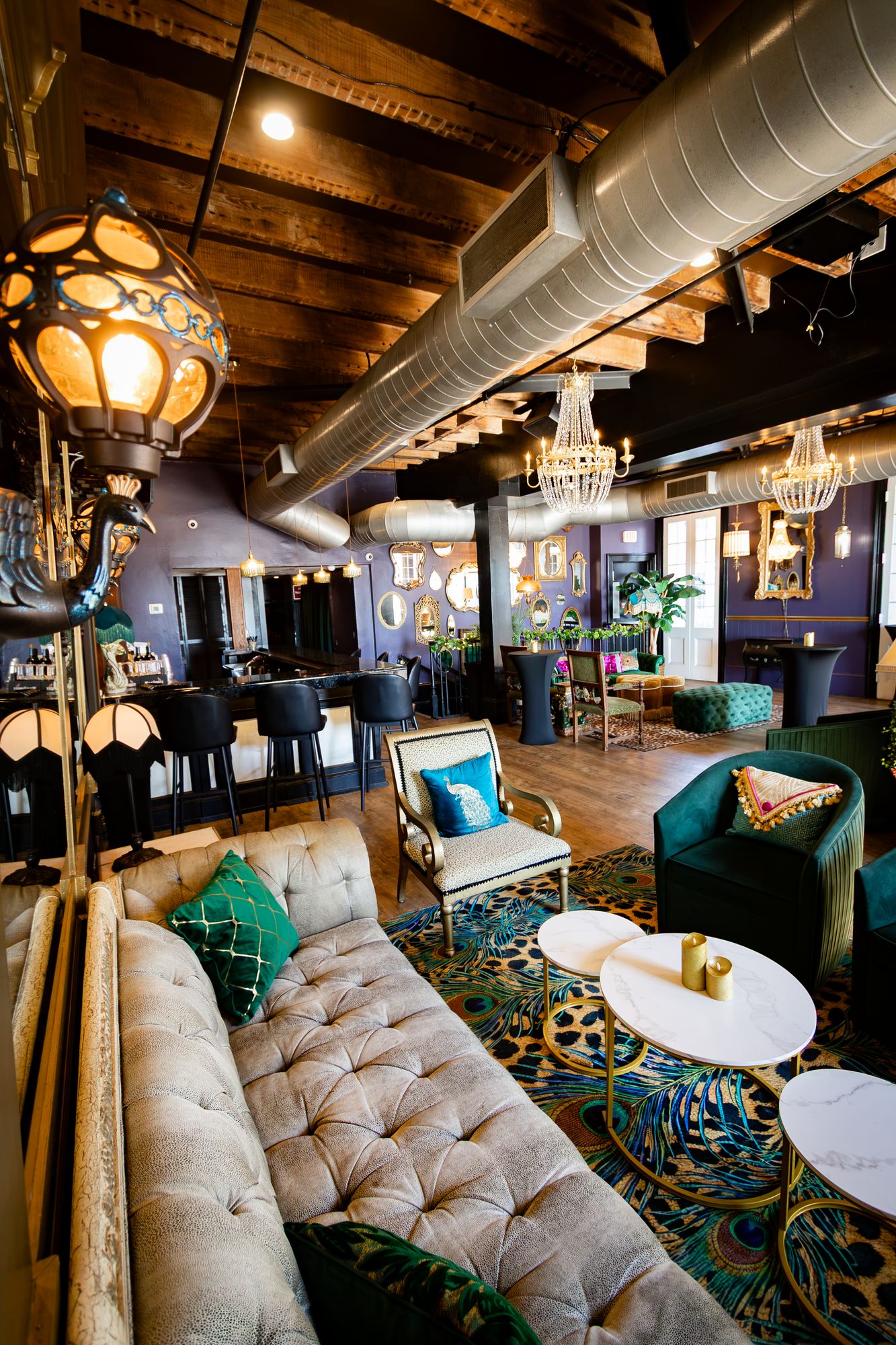 Tufted sofa and marble cocktail tables in the main lounge