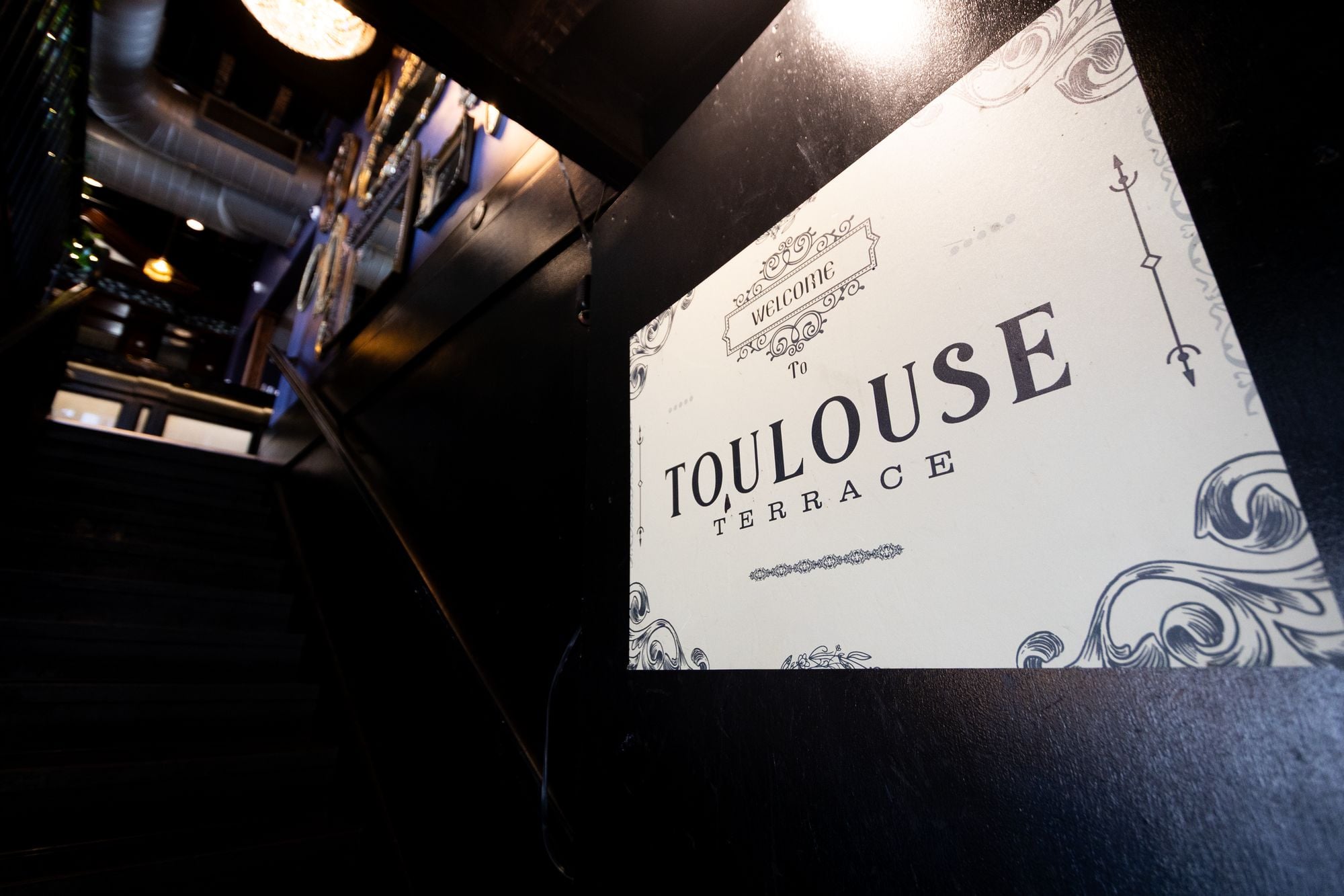 Welcome to Toulouse Terrace sign at the top of the staircase
